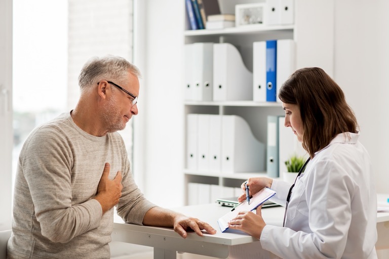 Doctor talking to a male patient