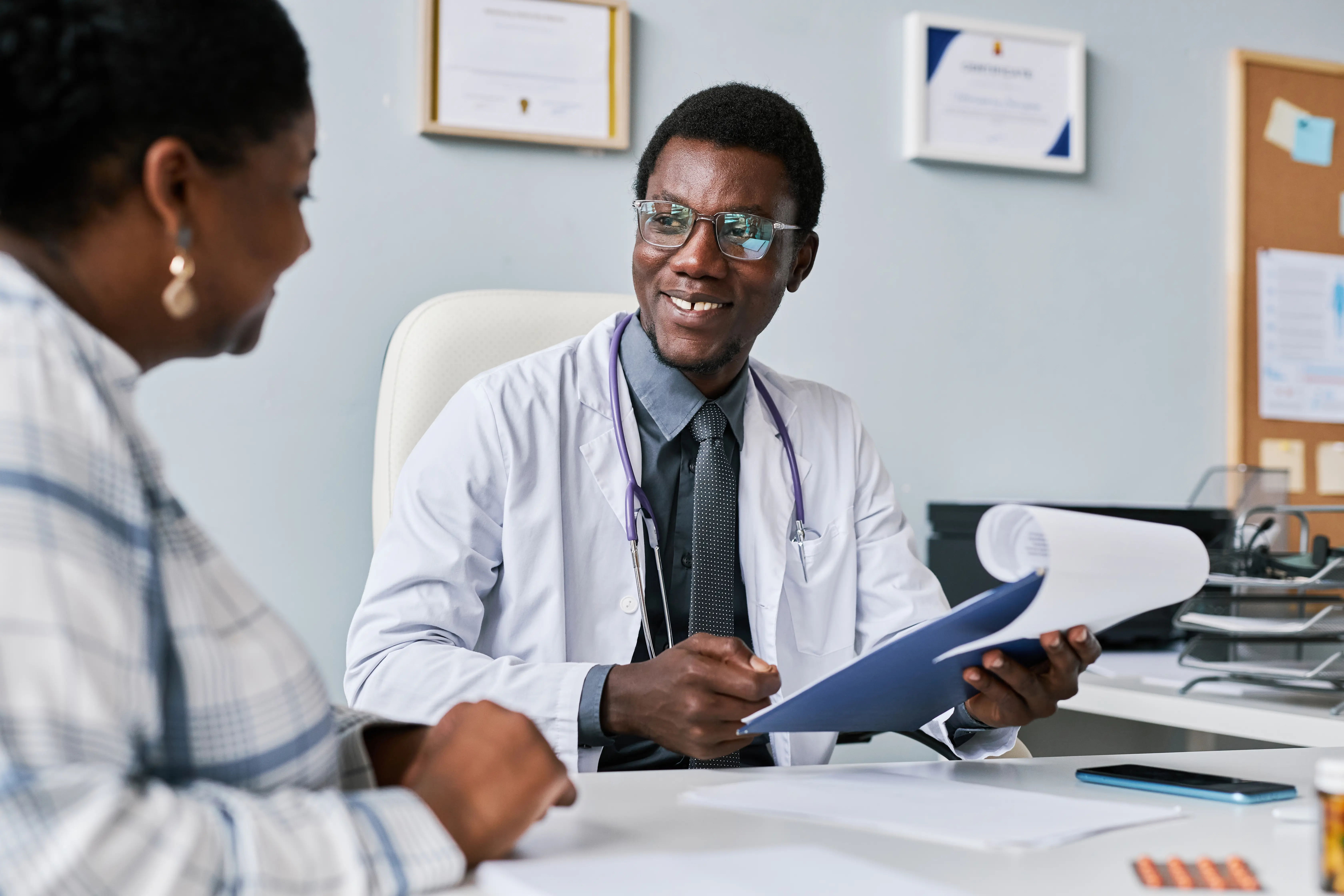 Doctor with a clipboard during a consultation